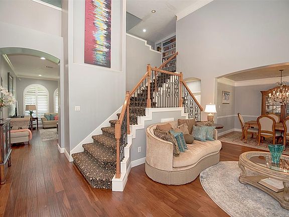 Upon entering the home you are greeted with a stunning view of the formal living and formal dining, as well as a glimpse into the family room. Gorgeous Acacia hardwood flooring, crown molding and 6-in. baseboards flow throughout the first floor. A do