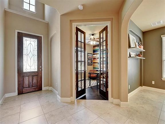 Welcome your guests into this bright and warm foyer... with easy access to this private owner's stud