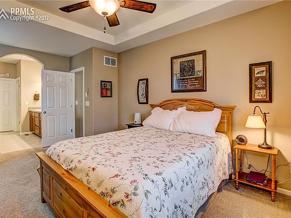 Spacious Master Suite Has Coffered Ceiling