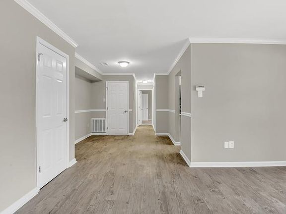 View into Dining Area and on Into Bedroom Area