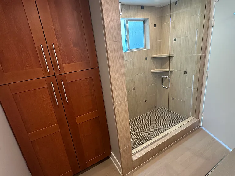 Linen Storage and Walk In Shower with Window