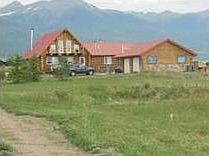 Front of house and view of mountains