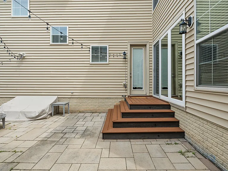 Stairs leading to Private fenced patio on back of the house.
