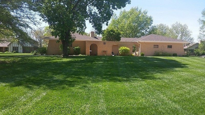 Front. All brick. Large corner lot.