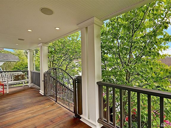 Absolutely beautiful covered front porch with custom iron gate, bead board ceiling and built-in surround sound. A fantastic spot to enjoy your morning beverage.