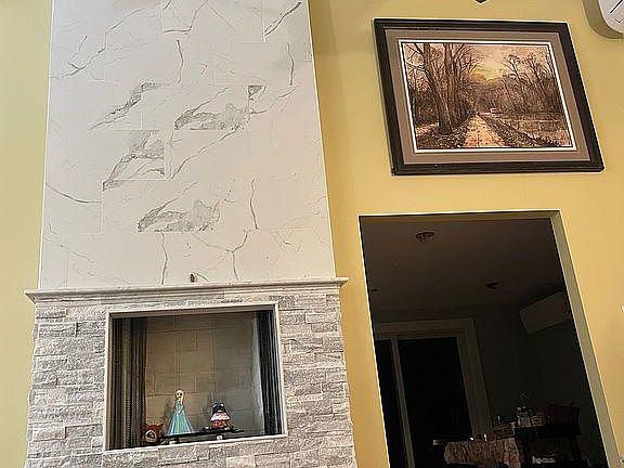 Marble tiled Fireplace livng