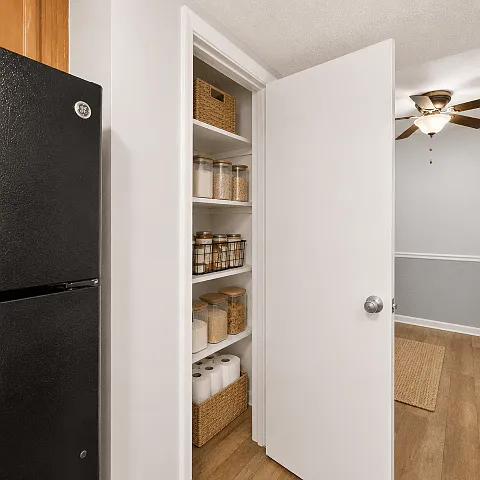 Multi-shelf pantry keeps groceries and household items organized.