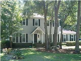 Front of the traditional 2-story home on golf course lot in Snee Farm.