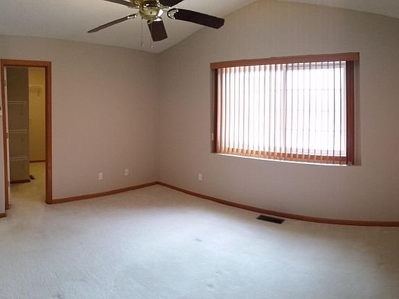 Master suite with walk-in closet and walk-through bathroom