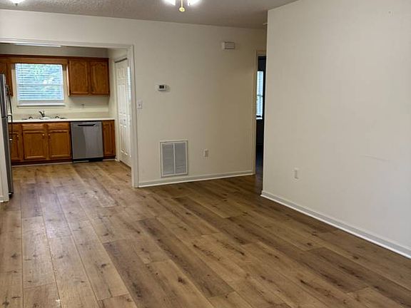 Living room with open floor plan to kitchen