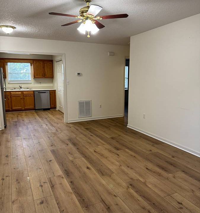 Living room with open floor plan to kitchen