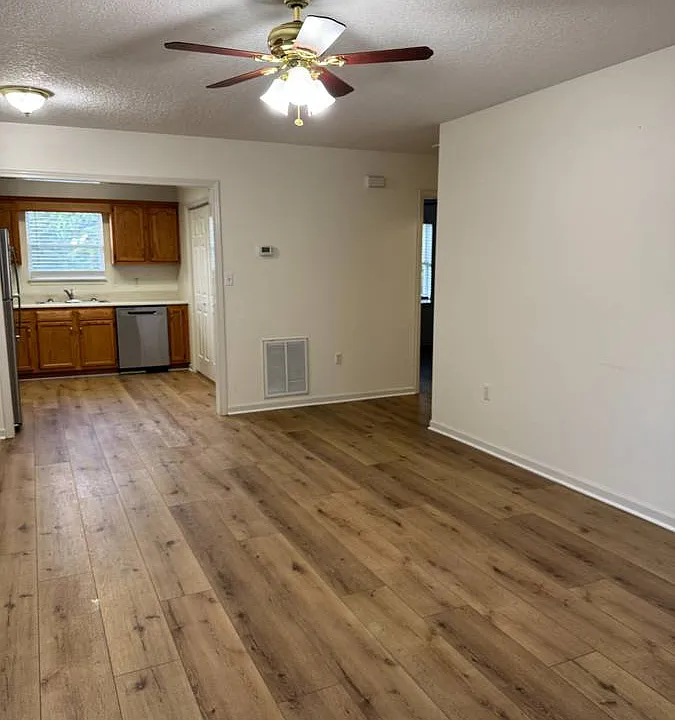 Living room with open floor plan to kitchen