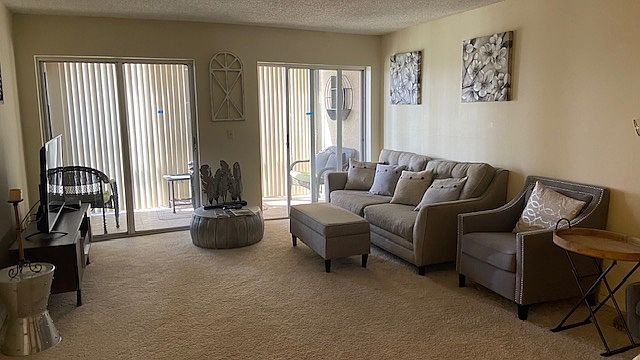 Open concept Living Room which leads to enclosed terrace.