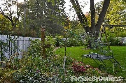 Back yard : Perennials make this an easy keeper w mowing a minimum.