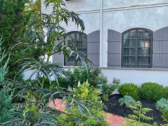 Lush, mature landscaping.