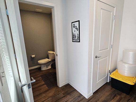 Entry mudroom, half-bath, coat closet, and attached garage access.