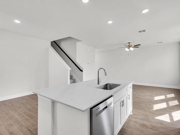 Kitchen Facing Breakfast Nook and Living Room