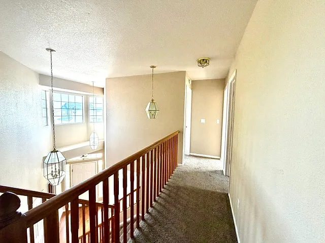 Two guest bedrooms on the opposite side of the primary bedroom.