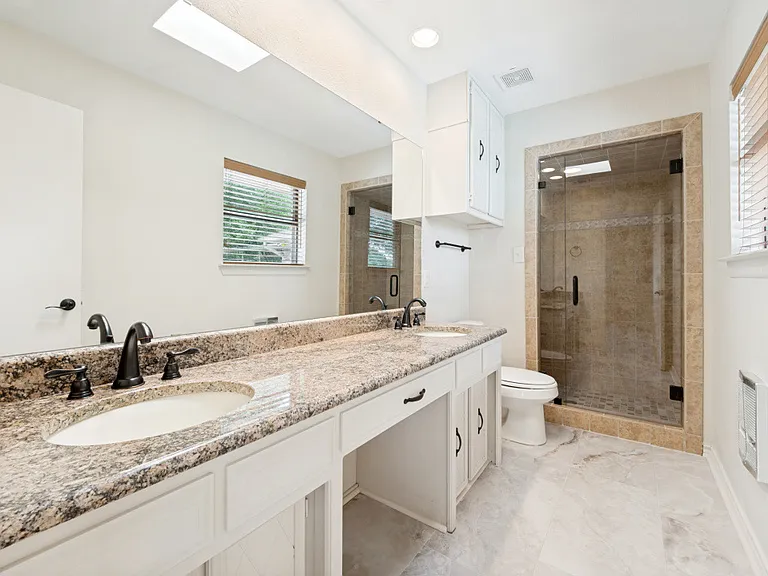 Master back with shower and granite countertops and double sinks