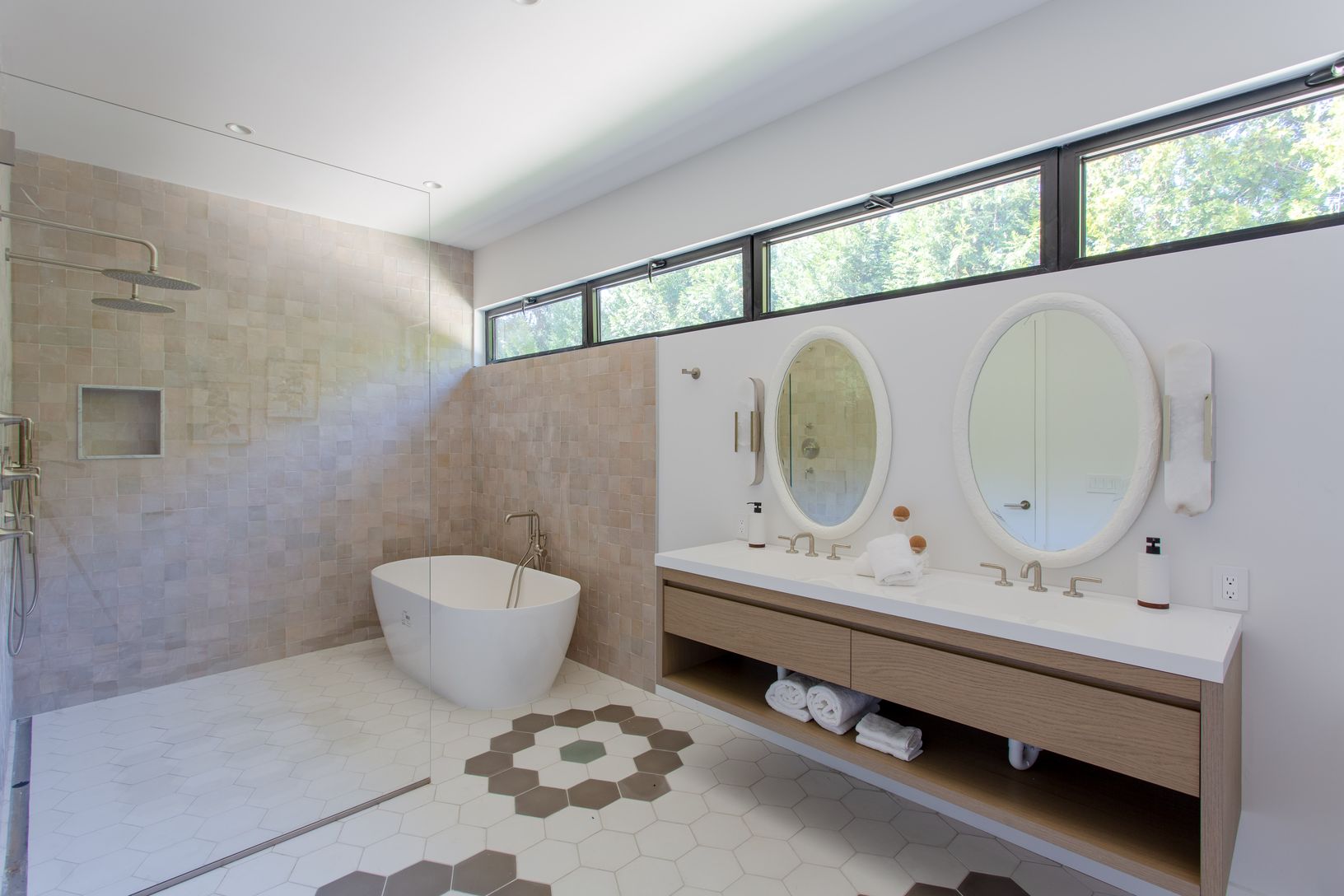  Primary bathroom with double vanity, walk in shower and soaking tub