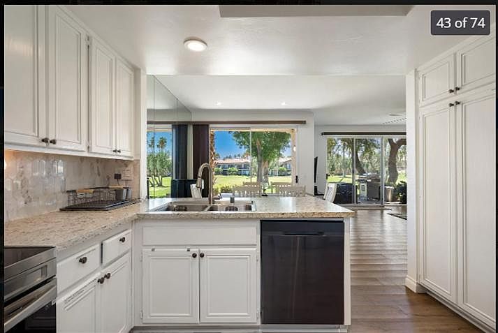 Panoramic kitchen view overlooking lush fairways_where morning coffee meets serene greens. ______