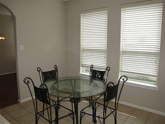 Charming breakfast book boasts ceramic tile flooring, 2" blinds, & recessed lighting! What a wonderful setting for informal meals or morning coffee!