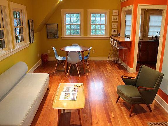 Mid-century modern coffee table and upholstered chair.