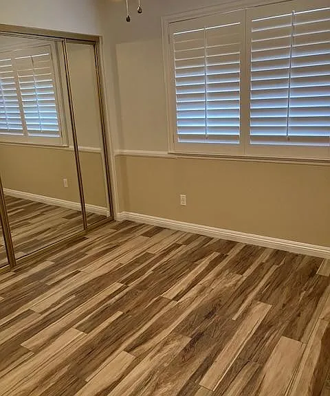 Bedroom with Gold Closet Doors
