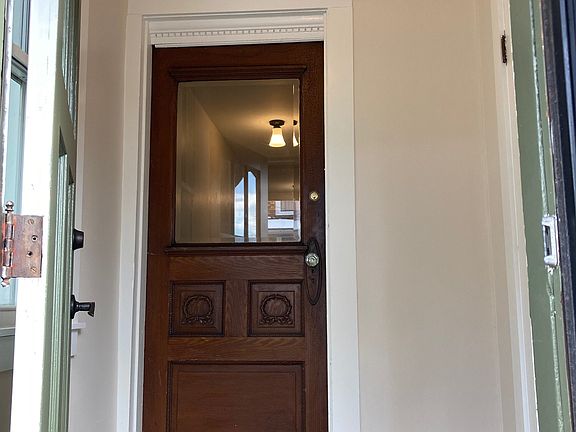 Double door entry with tile floor and large closet.