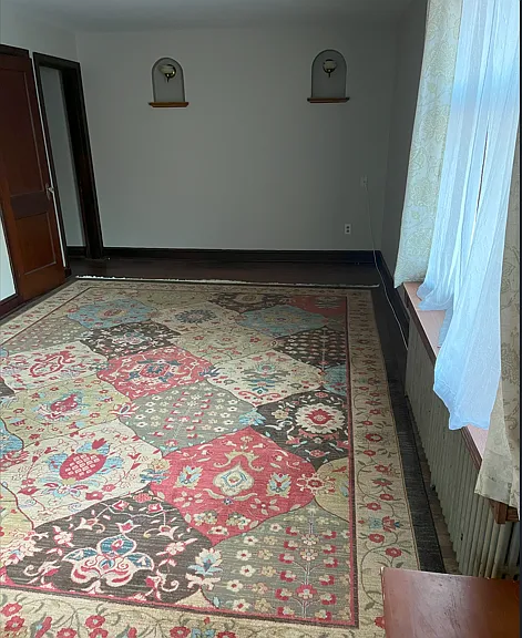Large living room with working sconce lights
