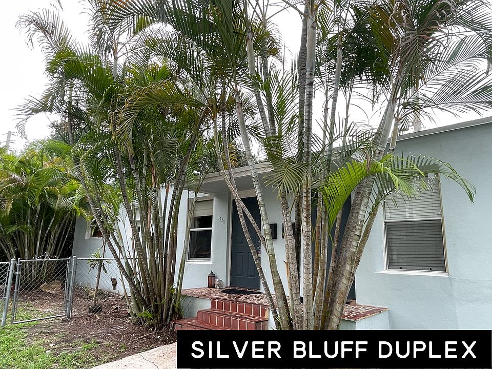 Duplex from street with dedicated fenced front yard