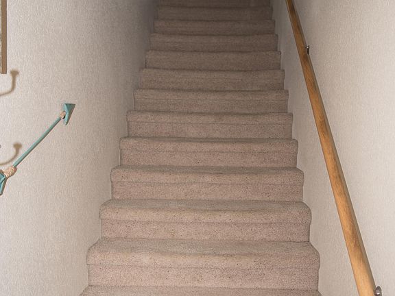Stairway, from front door and garage entry.  (Apartment is a