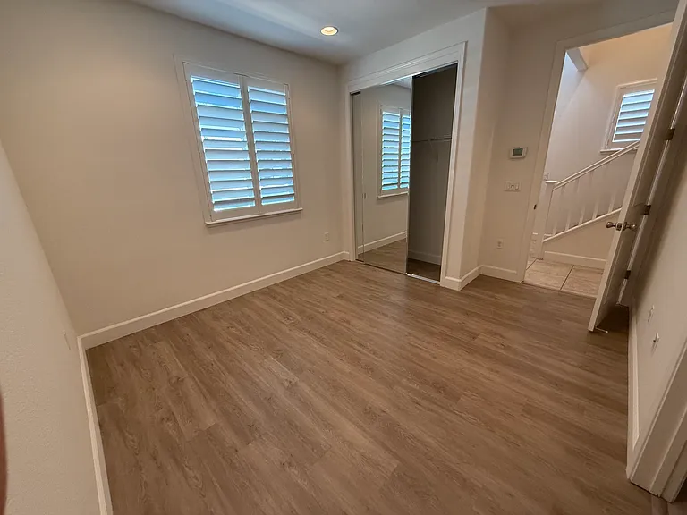 the bedroom with a full bathroom inside on the 1st floor