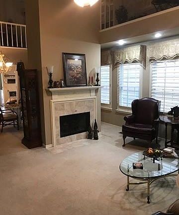 Living Room w/Marble Fireplace.