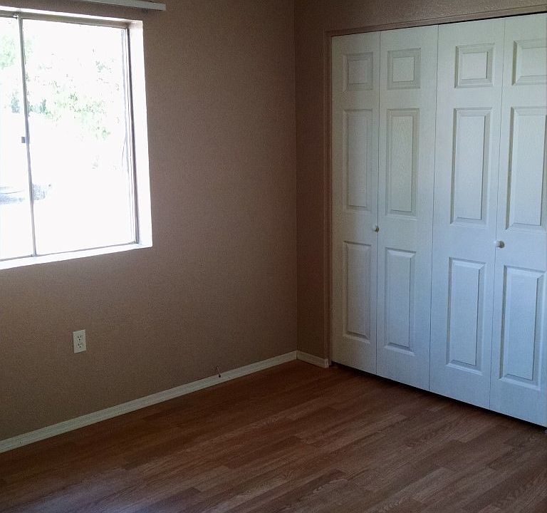 Guest Bedroom with Wood Flooring & Ceiling Fans!
