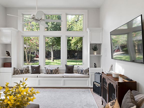 Fantastic sunroom addition gives views to the expansive fenced backyard