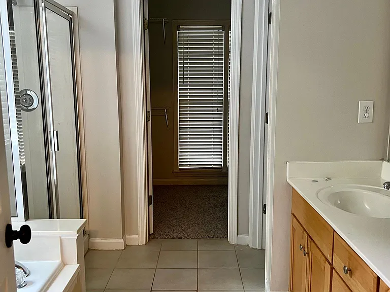 Master bath with dual vanities, separate soaker tub and shower