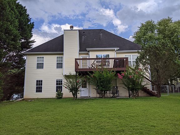 Back of the house where private entrance is located on lower floor