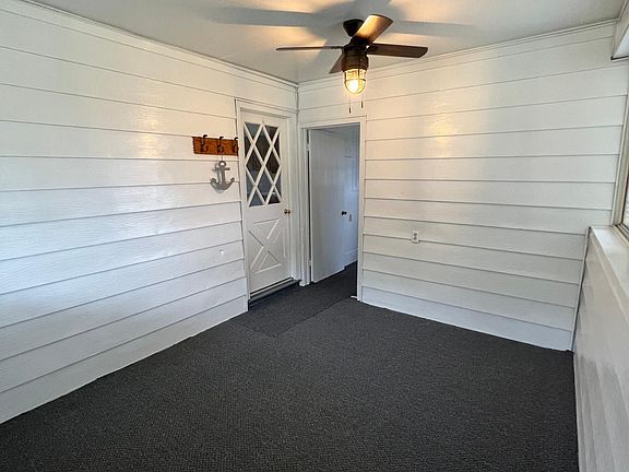 Porch area coming in from attached covered parking