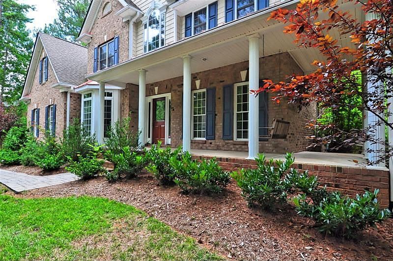 Classic Southern charm: rocking chair front porch + columns
