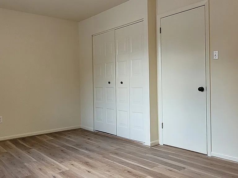 this is sample pics of the bedrooms as the pictures I have of the exact configuration still show the old carpeted flooring . Basically the closet is on the end wall rather than parallel to the window they are perpendicular.