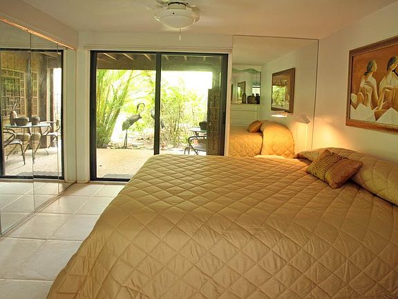 bedroom looking to lakeside patio