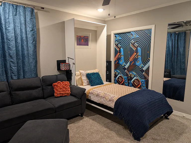This bedroom offers a highly flexible living space with a comfortable bed featuring a removable two-inch memory foam topper, allowing you to easily adjust the mattress firmness to your personal preference.