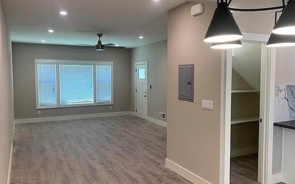 View of living room, walk-in pantry on the Right, as seen from the dining area