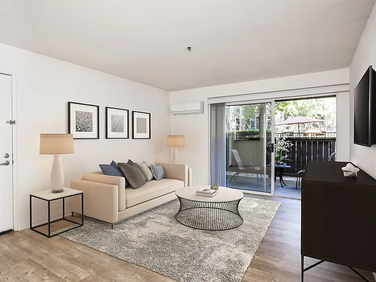 Classic Package living area with balcony access and hard surface flooring