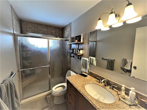 Bathroom with large walk-in shower.