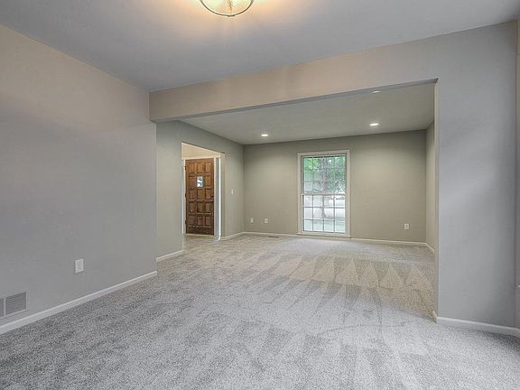 Large open combined living and dining room and with plenty of windows.