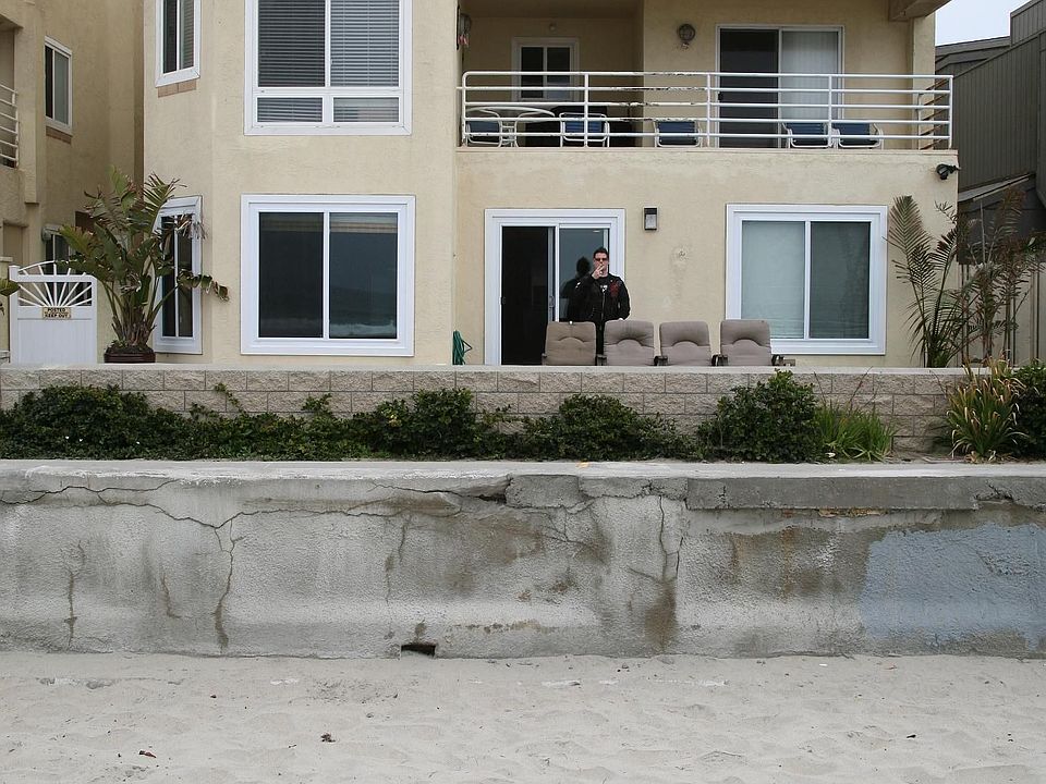 The bottom unit, 50 feet of ocean frontage, image taken from the beach
