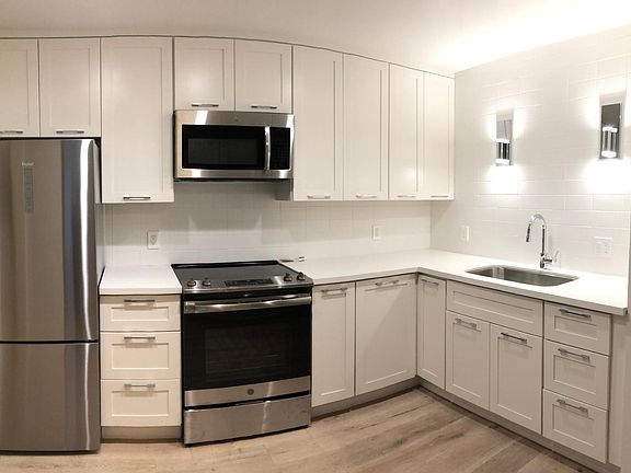 Brand new kitchen with stainless steel appliances