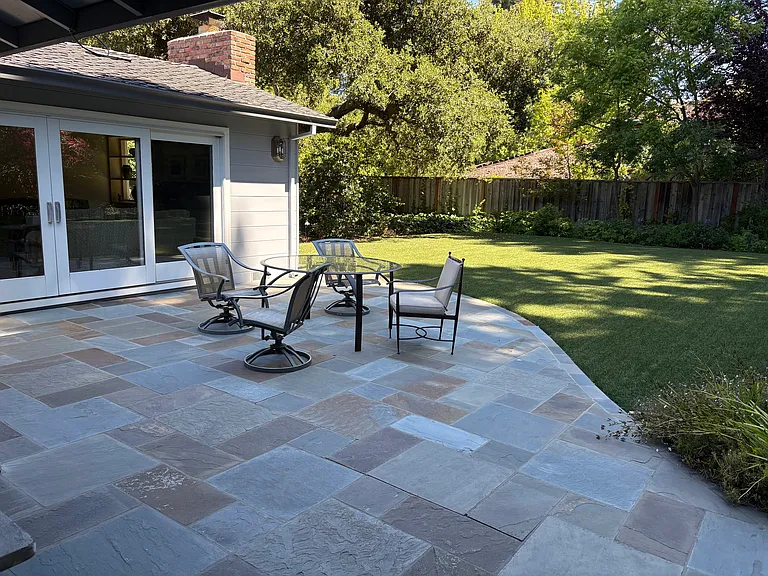 Connecticut bluestone patio opens to private and expansive back yard